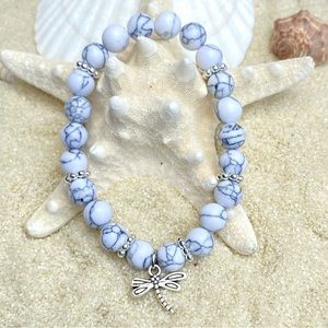 Beaded bracelet-white howlite beads with silver tone accents and dragonfly charm